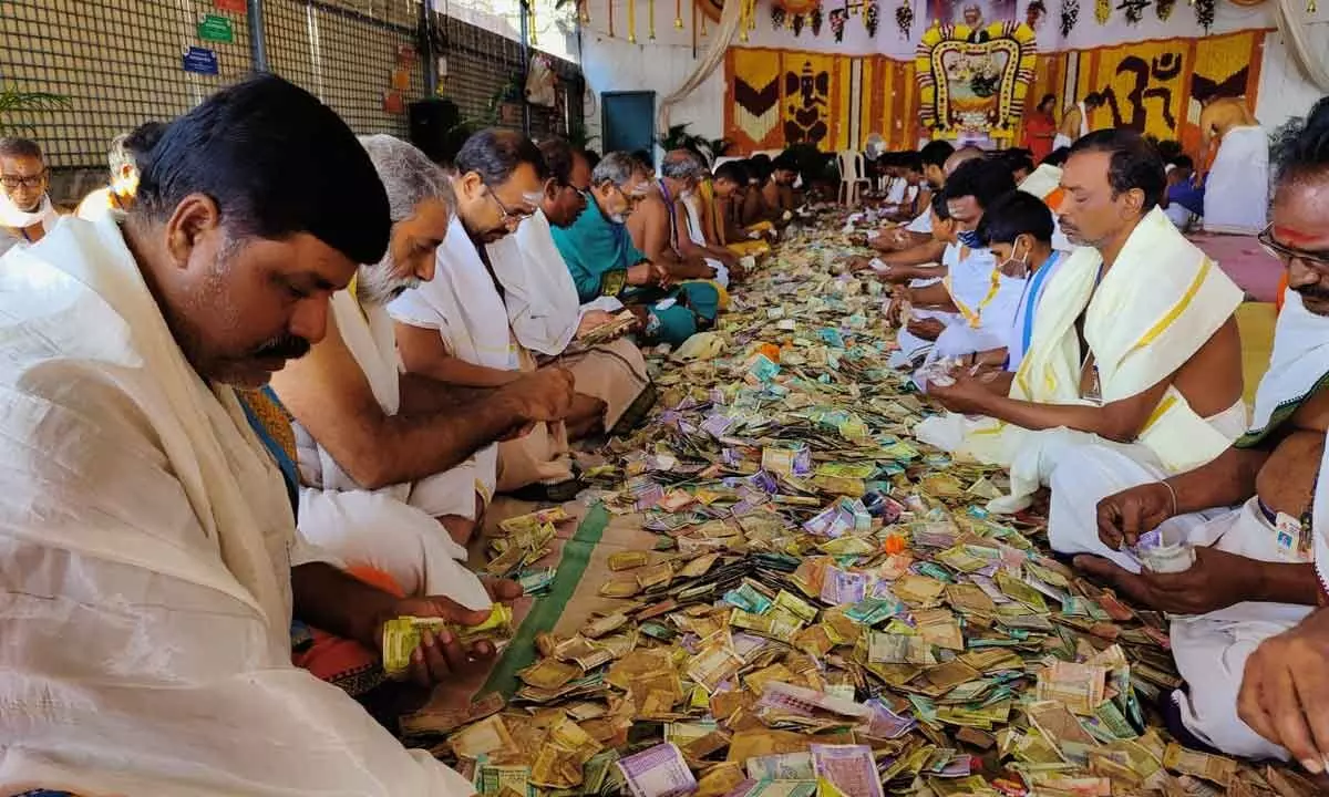 Staff counting Hundi offerings at Srisailam temple on Tuesday