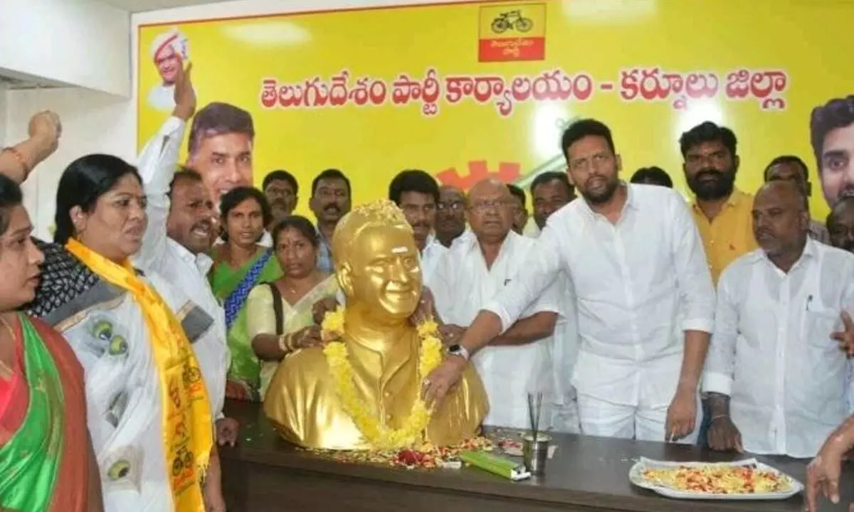 TDP leaders Somisetty Venkateswarlu and TG Bharat paying floral tributes to former chief minister NT Rama Rao on the occasion of his 27th death anniversary  at party office in Kurnool on Wednesday.
