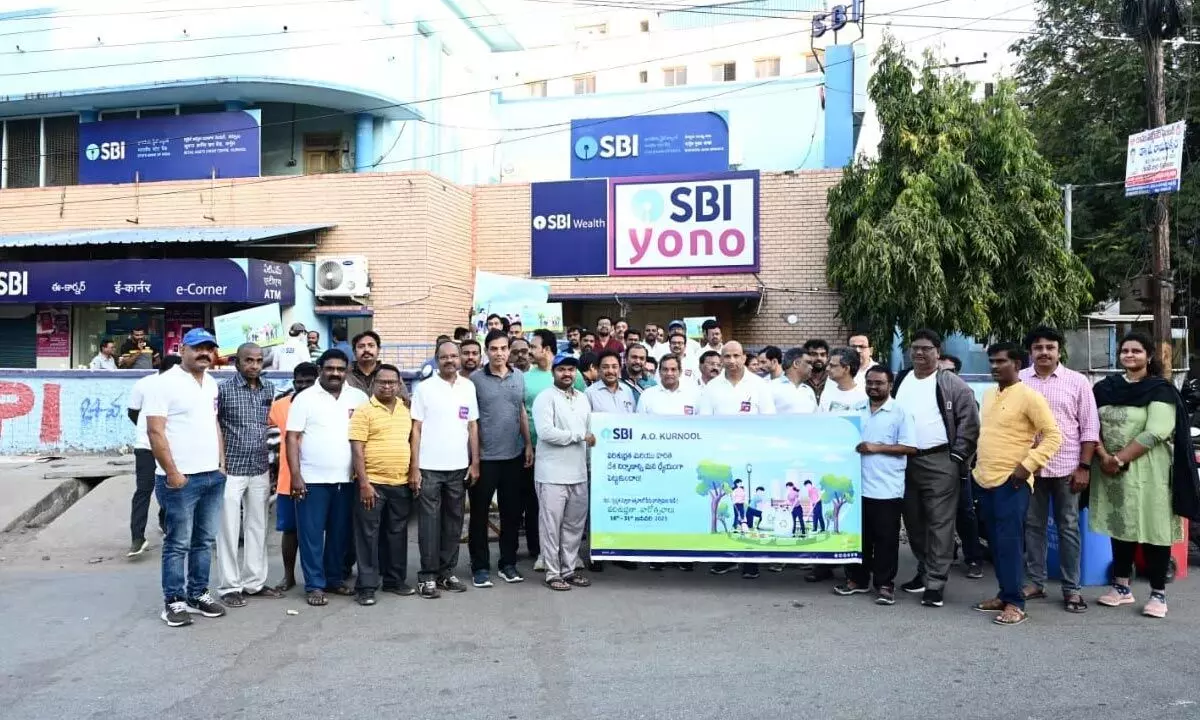 Employees of State Bank of India taking part in an awareness rally in Kurnool on Wednesday