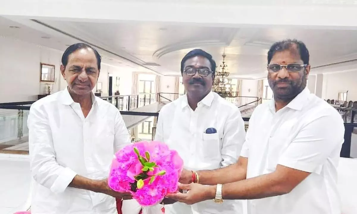 Transport Minister Puvvada Ajay Kumar with MP Vaddiraju Ravichandra presenting a flower bouquet to Chief Minister K Chandrashekhar Rao on Thursday