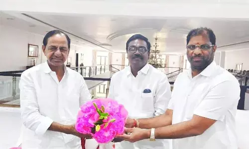 Transport Minister Puvvada Ajay Kumar with MP Vaddiraju Ravichandra presenting a flower bouquet to Chief Minister K Chandrashekhar Rao on Thursday