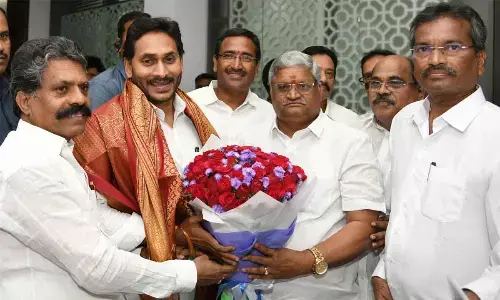 APNGOs Association president Bandi Srinivasa Rao,  general secretary K V Siva Reddy and others felicitating Chief Minister Y S Jagan Mohan Reddy at his camp office in Tadepalli on Thursday