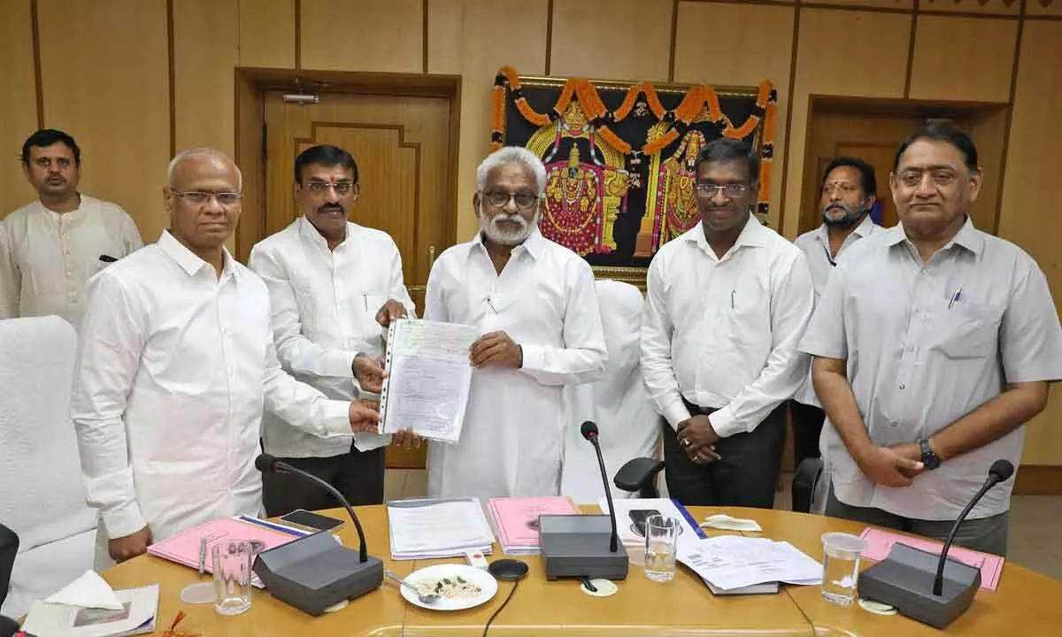 Hyderabad-based EVSR Consultancy representative handing over Rs 10,00,116 demand draft towards donation to SVBC Trust to TTD Chairman YV Subba Reddy and EO AV Dharma Reddy, in Tirupati on Friday.