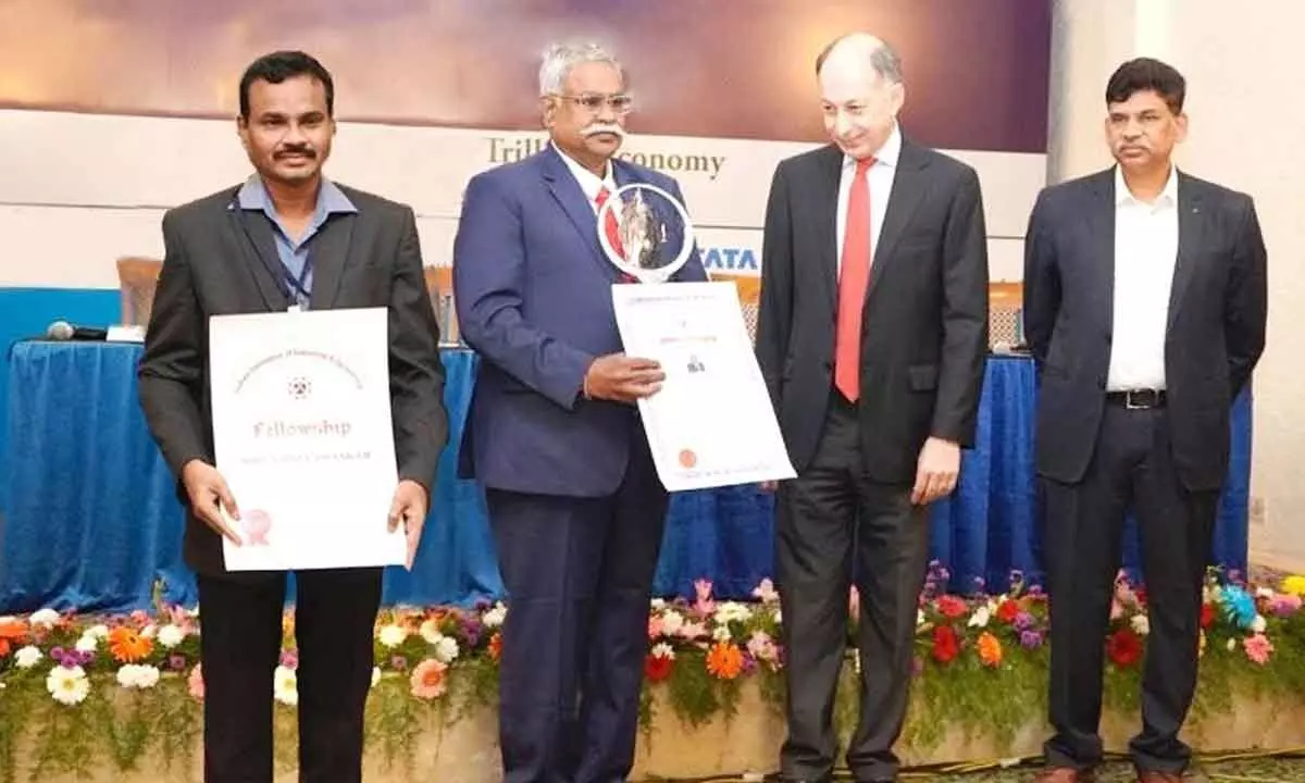 SCCL Administrative Officer Nimma Bhasker (first left)  receiving fellowship award from IIIE at Pune