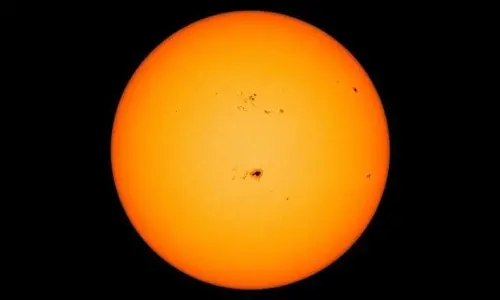 The highly active region AR3190 as seen on the Sun in centre