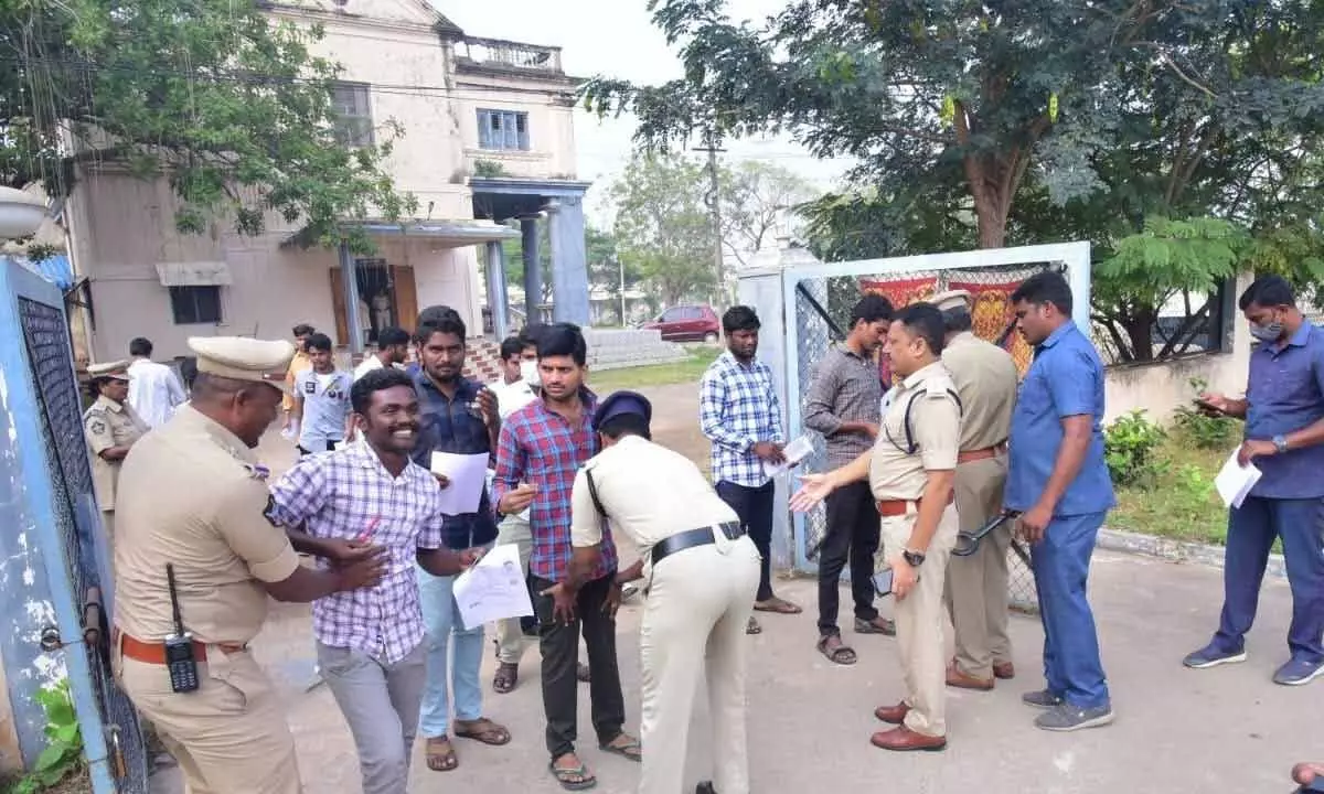 Police checking the candidates at an exam centre in Machilipatnam on Sunday