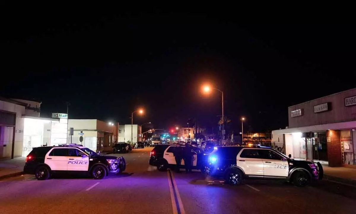 Police vehicles block the street near a scene where a shooting took place in Monterey Park, California, US, on Sunday
