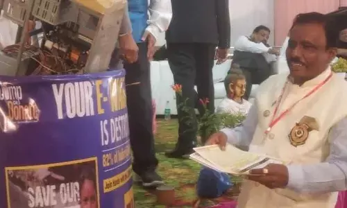 Noted industrialist Virupaksha Reddy showing e-waste while speaking at the seminar on e-waste management in Anantapur on Sunday