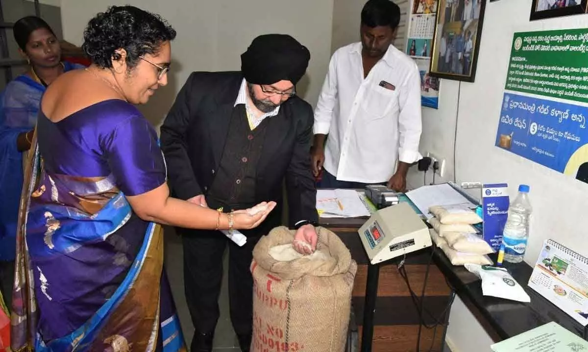 Director of Consumer Affairs and Public Distribution KMS Khalsa checking the quality of PDS rice at a ration shop in Vijayawada on Monday