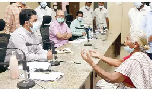 District Collector V Prasanna Venkatesh receiving petitions from people during Spandana programme at the Collectorate in Eluru on Monday