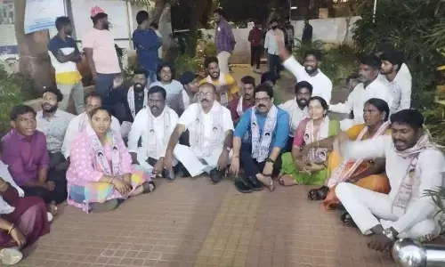 JSP leaders staging a dharna at the police station in Visakhapatnam on Monday