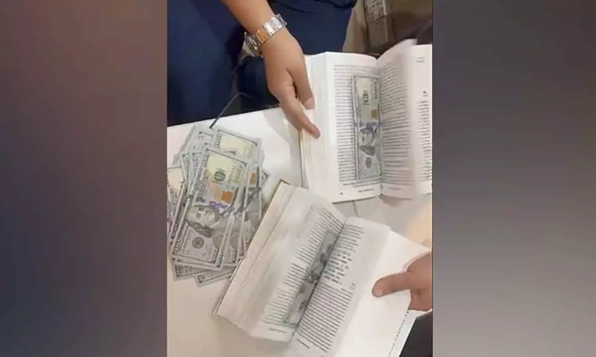 Man hiding $90,000 between book pages held at Mumbai airport