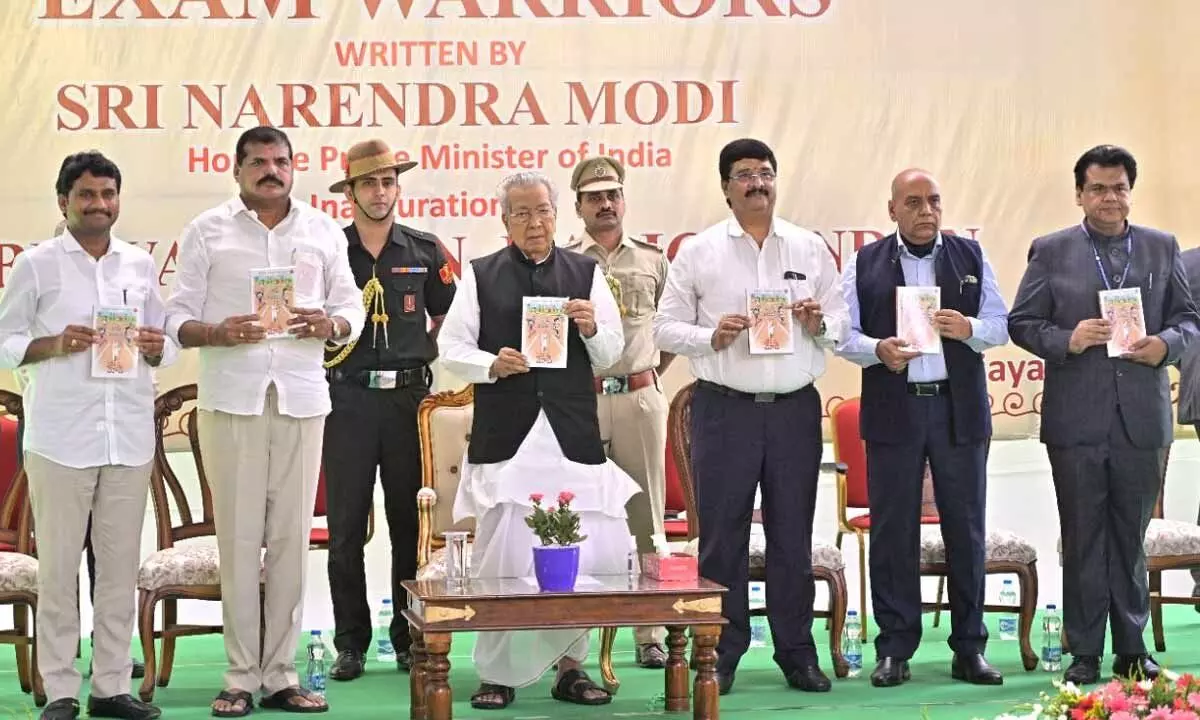 Governor Biswabhusan Harichandan along with education minister Botcha Satyanarayana and officials releases PM Narendra Modi’s book at Raj Bhavan