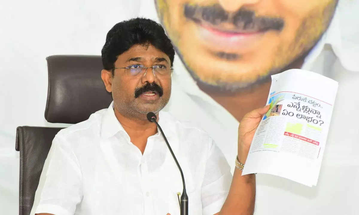 Minister for municipal administration and urban development A Suresh addressing the media at the YSRCP central office in Tadepalli on Wednesday