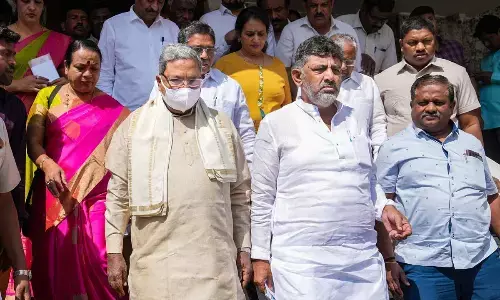 Karnataka Congress President DK Shivakumar and Leader of Opposition in Karnataka Assembly Siddaramaiah leave the party office to lodge a complaint against BJP leaders in Bengaluru on Wednesday