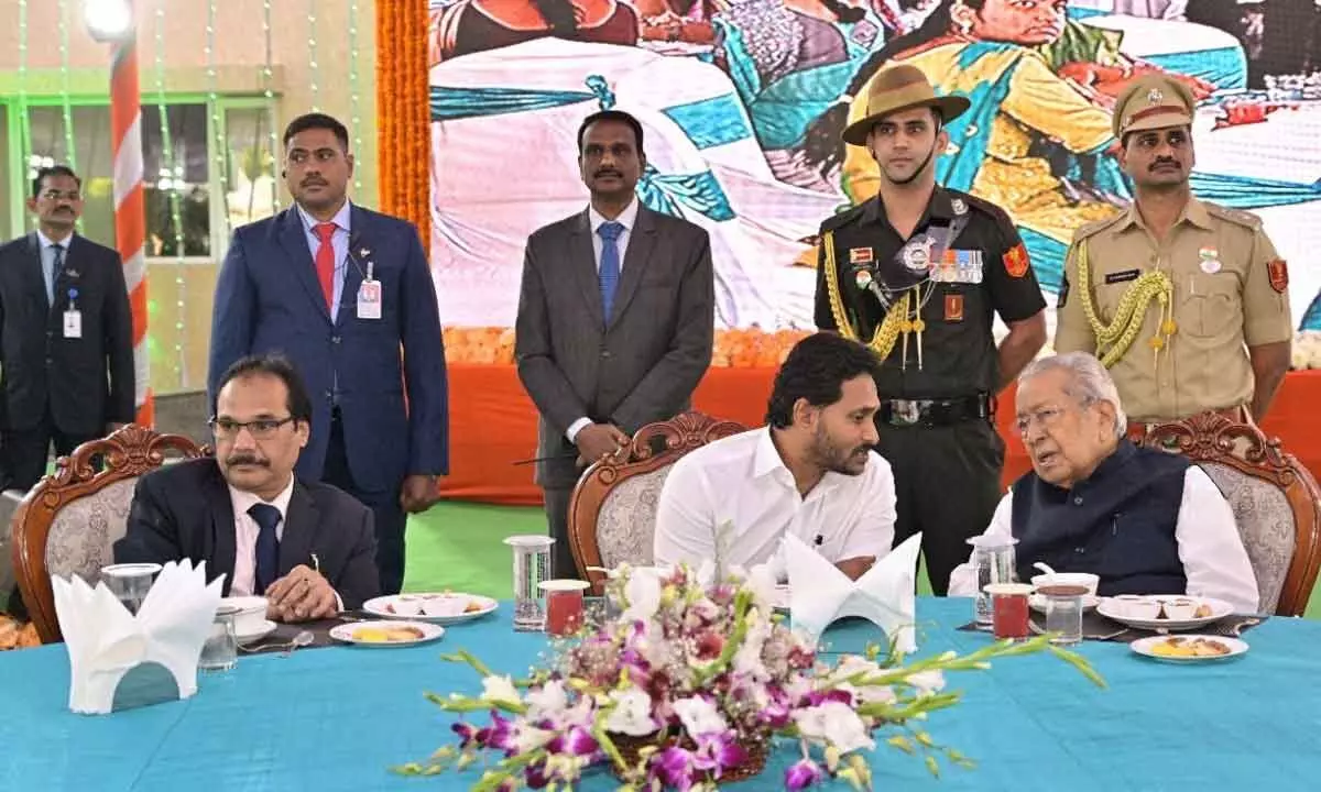 Chief Minister Y S Jagan Mohan Reddy has a word with Governor Biswabhusan Harichandan during At Home event organised as part of Republic Day celebrations at Raj Bhavan in Vijayawada on Thursday. AP High Court Chief Justice Prashant Kumar Mishra is also seen.