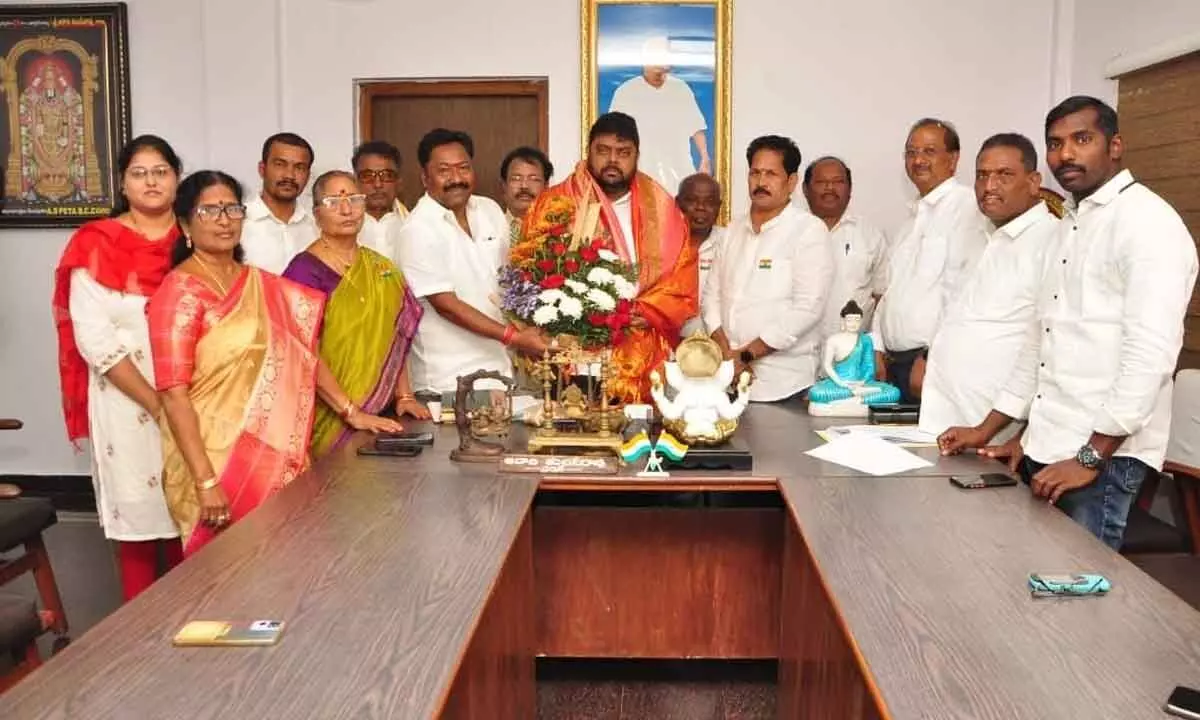 Directors and other officials congratulating the newly-appointed chairman of Visakha Dairy A Anand Kumar in Visakhapatnam on Thursday