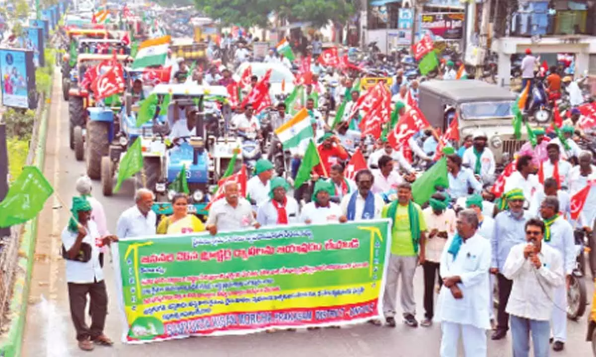 Farmers taking out a tractor and bike rally in Ongole on Thursday