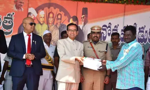 Sathya Sai District Collector Basanth Kumar presenting meritorious award to  I&PR AD Vedanayakam on Thursday