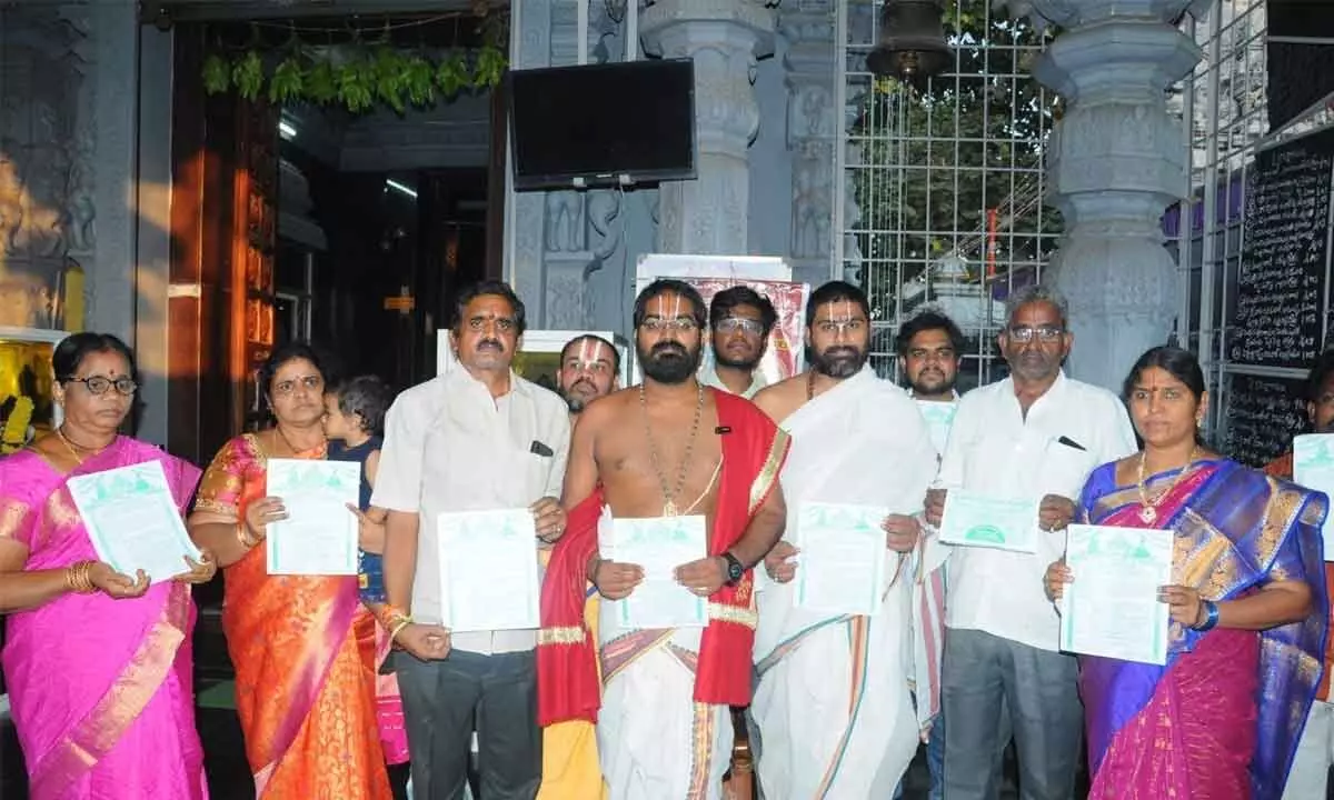 Temple trustees and priests releasing brochures of the annual Chandana Yatra festival at Sri Varahalakshmi Nrisimha Swamy Kshetra in Rajamahendravaram on Friday