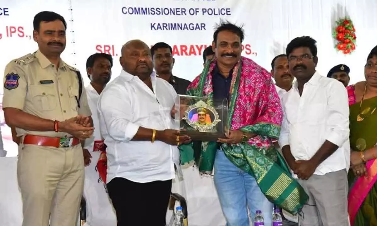 Minister Gangula Kamalakar greets transferred Commissioner of Police  V Satyanarayana in Karimnagar on Friday