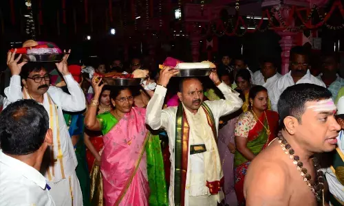 Endowment commissioner carrying silk clothes to offer it to Sun God on the eve of Radha Sapthami festival at Arasavalli