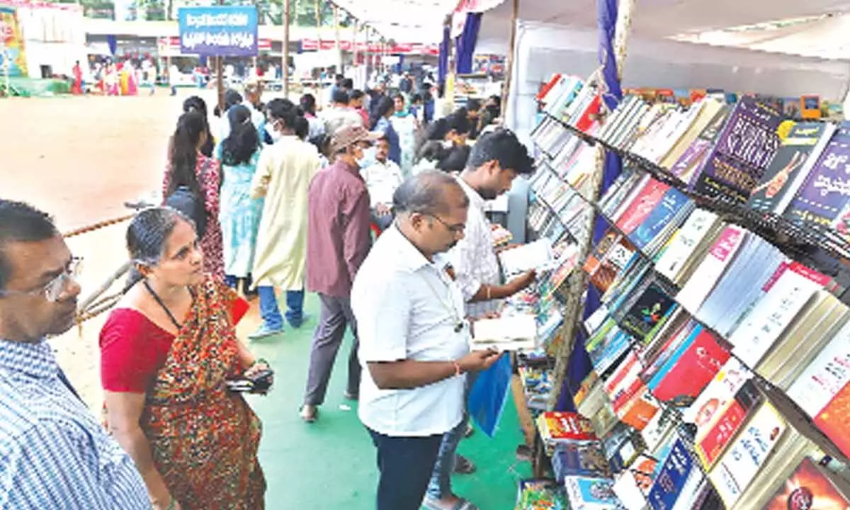 Book lovers going through various books at the exhibition in Tirupati on Sunday.