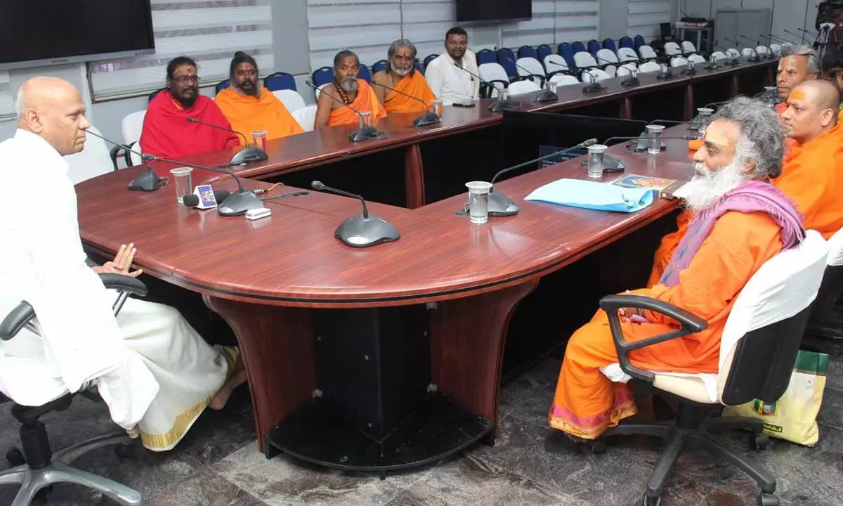 TTD EO A V Dharma Reddy explaining the TTD activities to a group of Sadhus in Tirumala on Sunday.