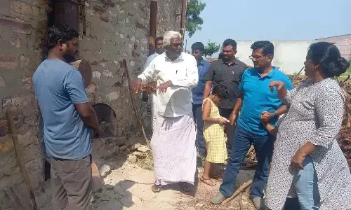 Prakasam District Collector AS Dinesh Kumar and Bapatla District Collector Vijaya Krishnan observing tobacco curing at a barn in Naguluppalapadu mandal on Sunday