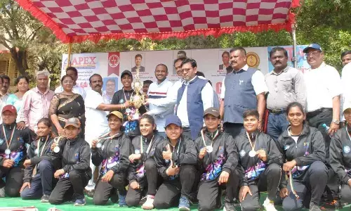YSRCP youth leader Balineni Praneeth Reddy presenting the cup to Uttar Pradesh womens team in Ongole on Sunday