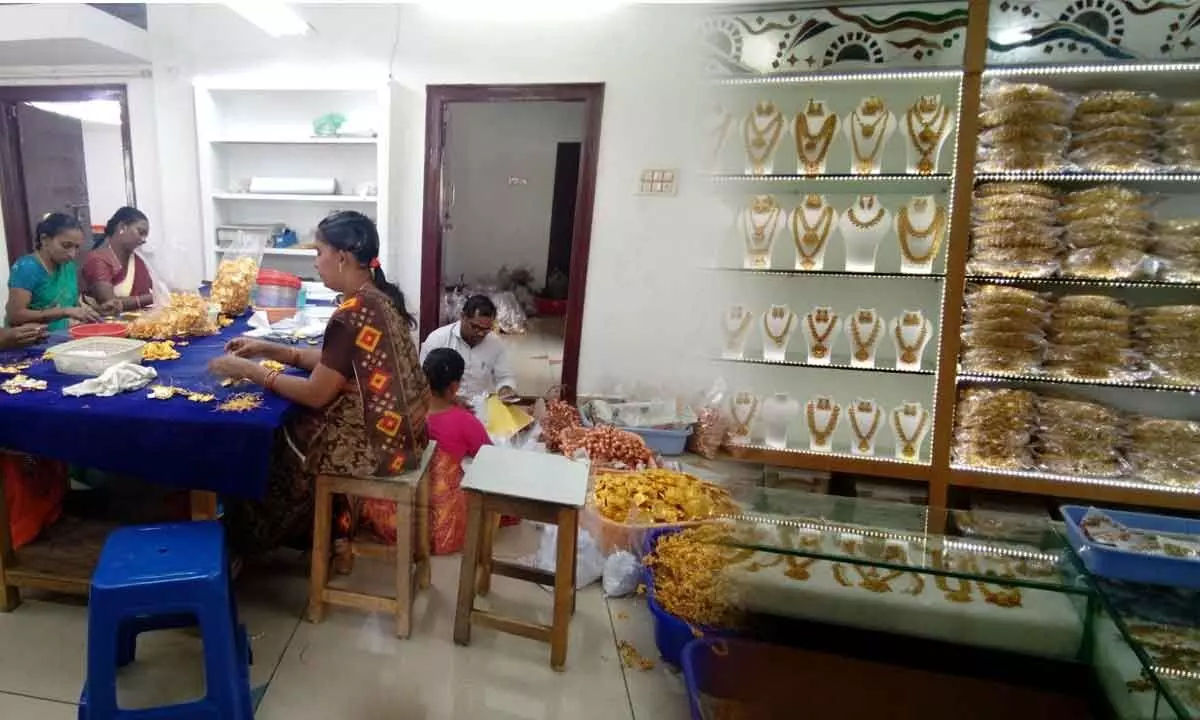 Workers making jewellery items in a manufacturing unit located at Jewellery park near Machilipatnam; Imitation jewellery / ornaments at a showroom in Machilipatnam