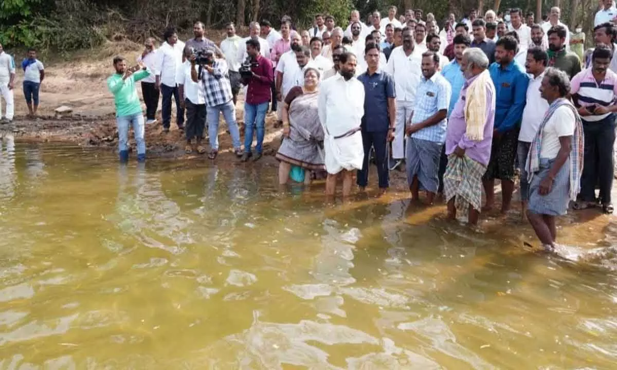 Speaker T Sitaram along with local leaders, officials and people inspects the spot of proposed road bridge at Balasalarevu at Nagavali river on Monday