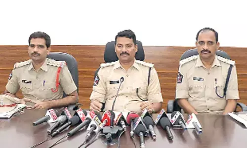 Additional SP P Srinivas addressing  the media at SP office  in Kakinada on Monday