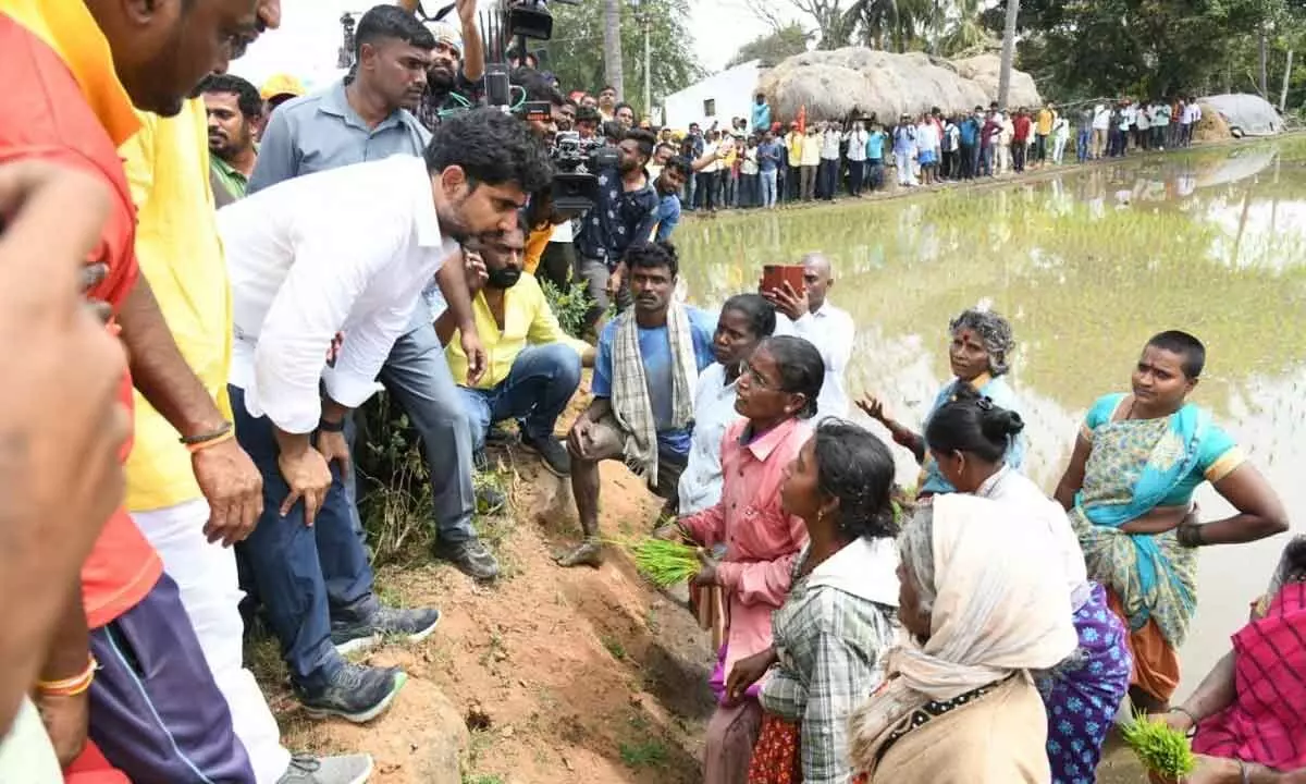 TDP national general secretary Nara Lokesh interacting with agricultural labourers at Devathoti of Baireddipalle mandal on Tuesday.
