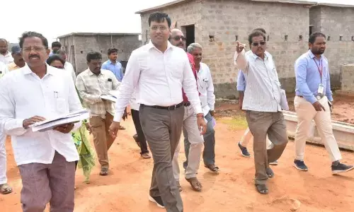 District Collector KVN Chakradhar Babu visiting Venkateswara Puram Jagananna layout in Nellore on Tuesday along with officials