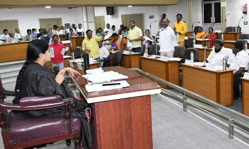 TDP and YSRCP corporators arguing over some issues on the agenda at VMC Council meeting in Vijayawada on Tuesday