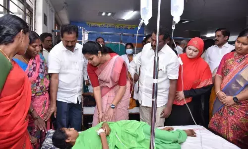 Minister Vidadala Rajini, Principal Secretary MT Krishna Babu, Guntur Collector M Venugopal Reddy and Palnadu Collector Sivasankar Lotheti consoling girl students undergoing treatment at  GGH in Guntur  on Tuesday