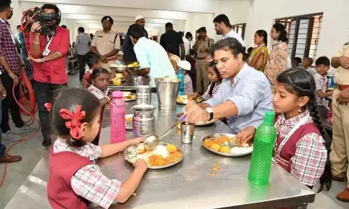IT Minister KT Rama Rao having lunch with children at the inauguration of  KG to PG institute at Gambhiraopet mandal on Wednesday