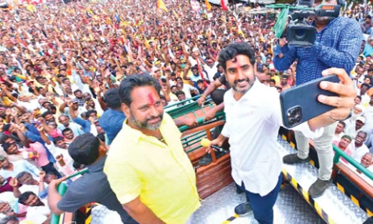 TDP national general secretary Nara Lokesh taking a selfie with former Minister  N Amaranatha Reddy while addressing the people in Palamaner on Thursday