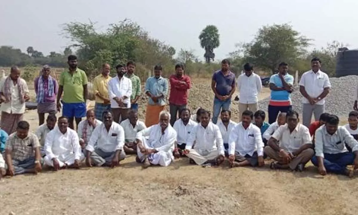 Kistapuram villagers staging protest against the pharma company in Monugodu on Thursday