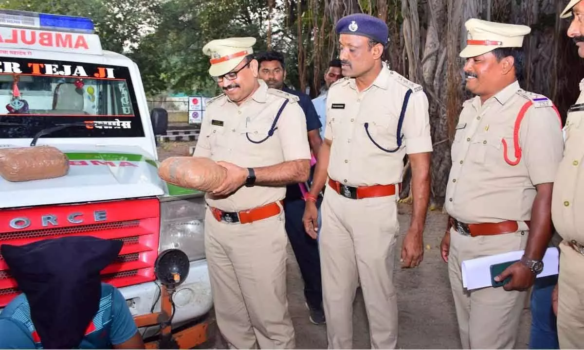 Jagtial Superintendent of Police A Bhaskar inspecting the confiscated ganja being transported in a private ambulance of Rajasthan