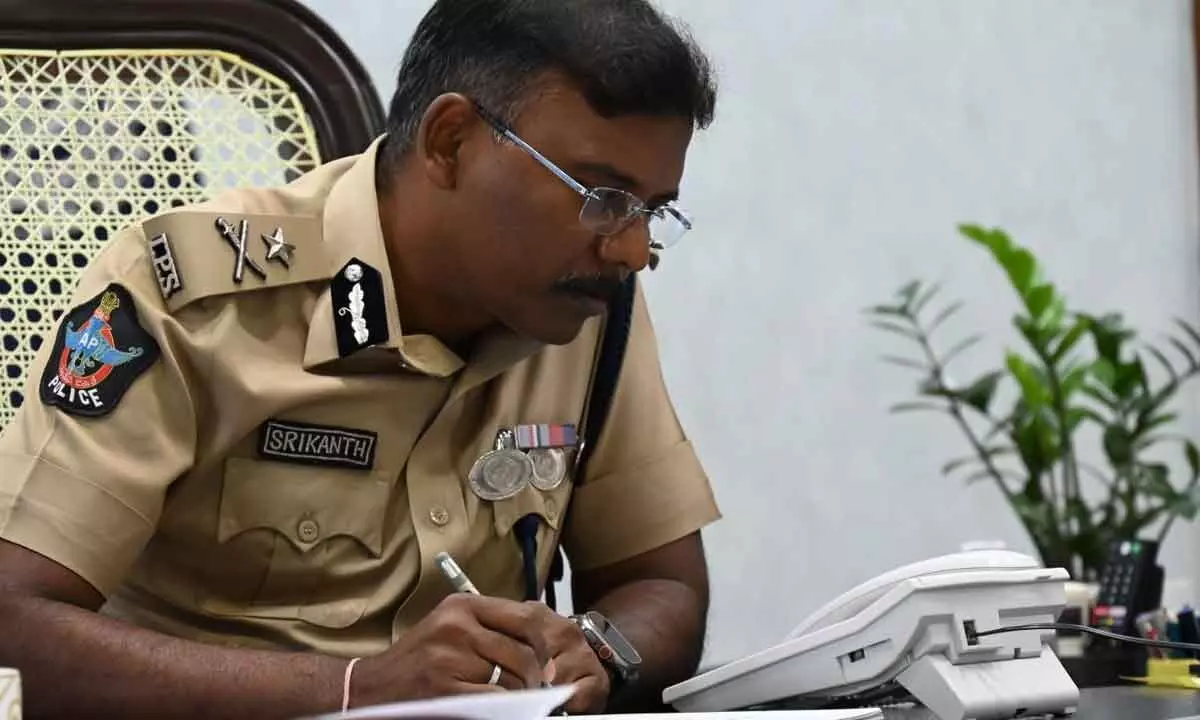City Police Commissioner Ch Srikanth receiving complaints over the phone in Visakhapatnam on Friday
