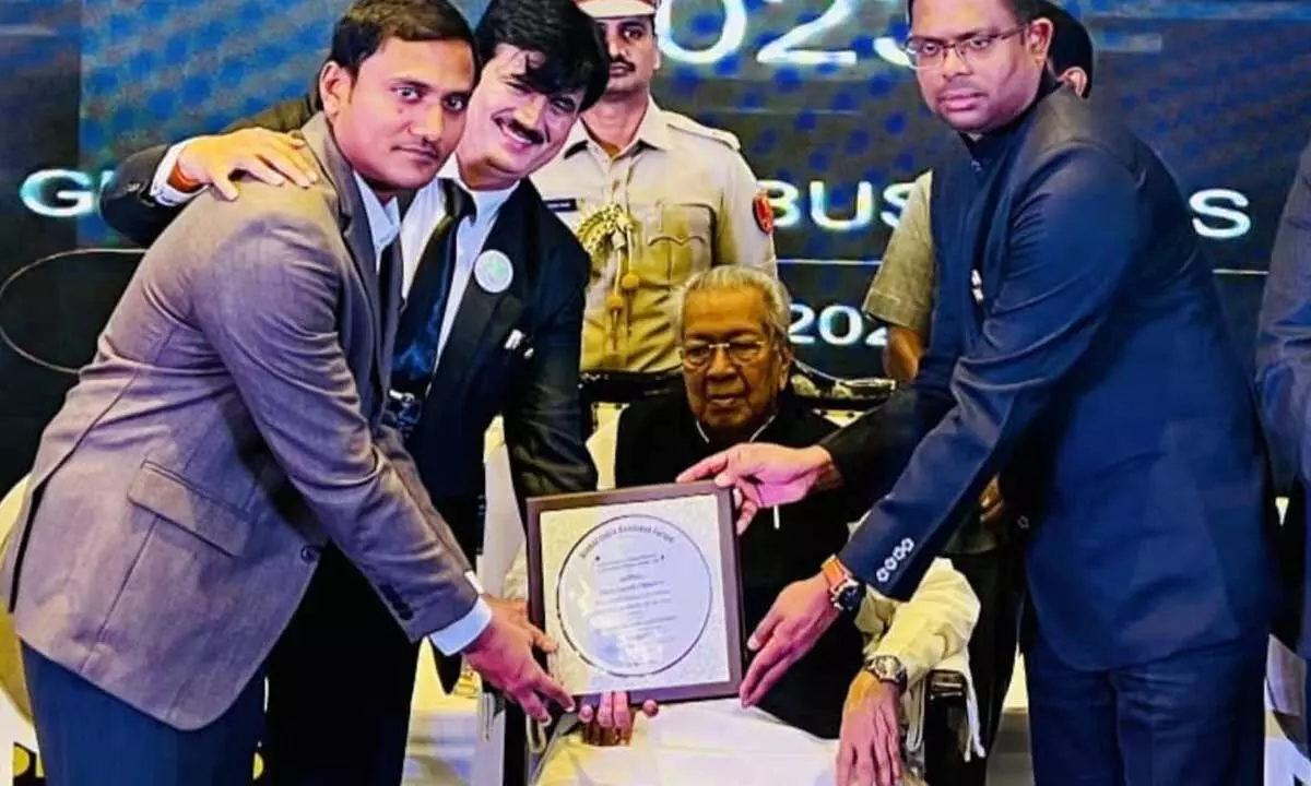 Sarath Chandra IAS Academy management receiving an award from Governor Biswabushan Harichandan