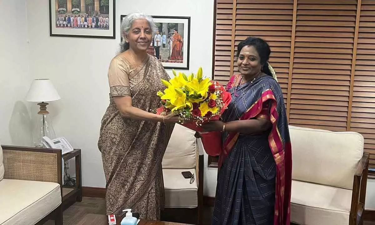 Governor Tamilisai Soundararajan congratulating Union Finance Minister Nirmala Sitaraman for introducing futuristic budget, in New Delhi on Sunday
