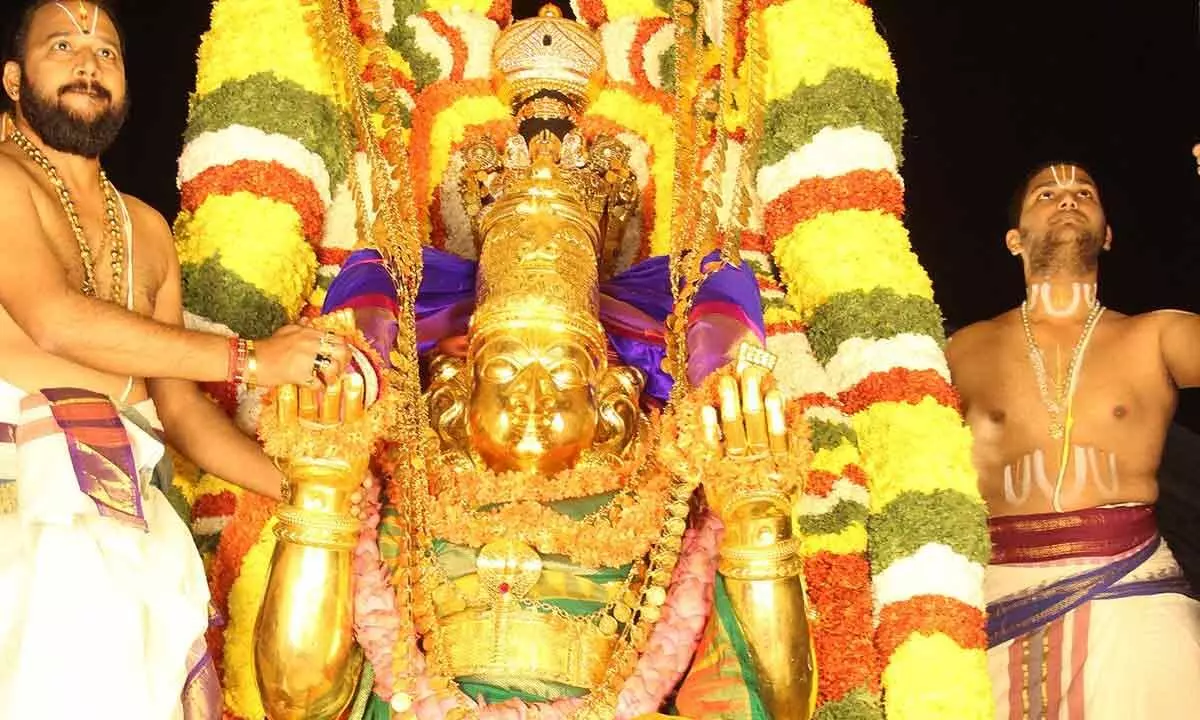 Lord Malyappa mounted on Garuda Vahanam, taken out in a procession in Tirumala on the occasion of Pournami on Sunday.