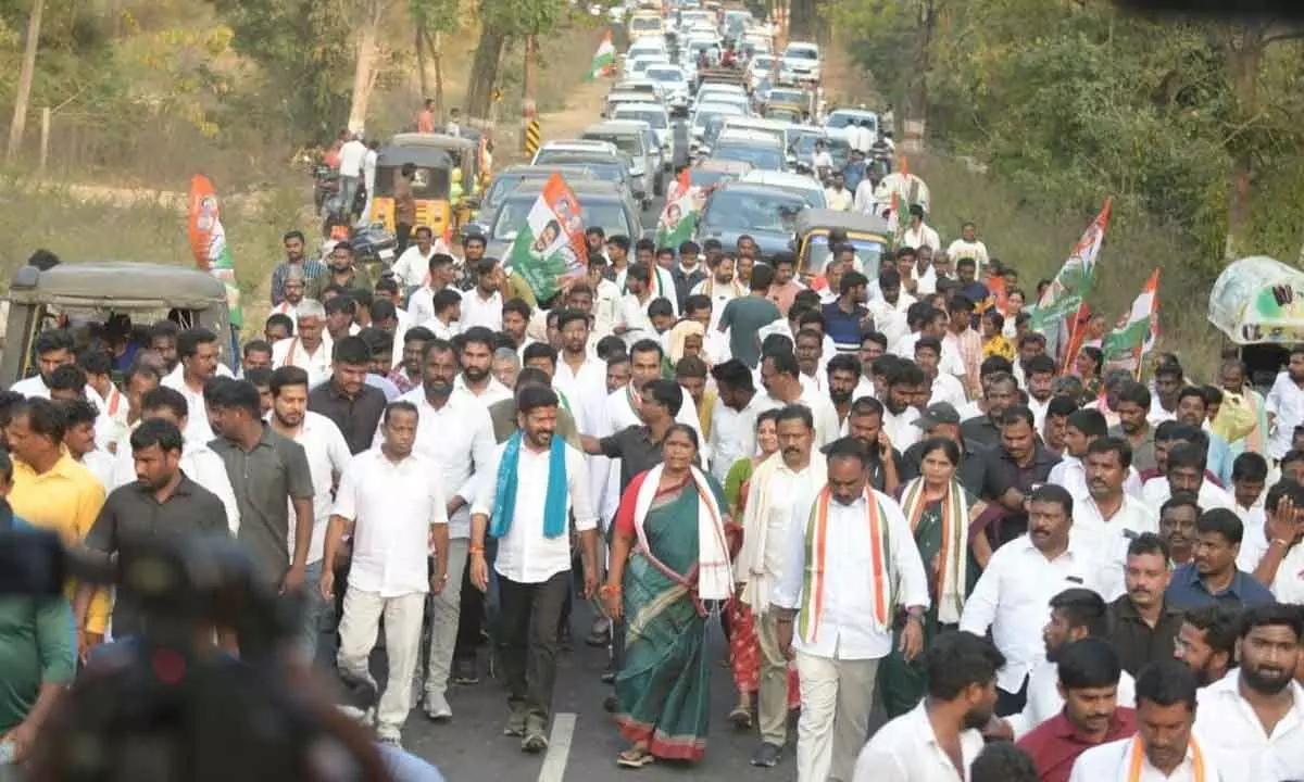 TPCC president A Revanth Reddy along with a large number of Congress cadres heading to Pasra from Medaram in Mulugu district on Monday