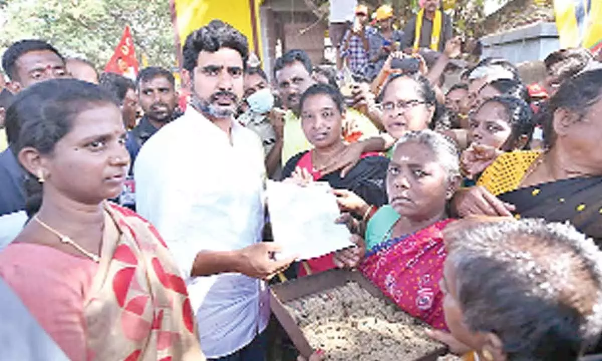 TDP national general secretary Nara Lokesh with beedi workers in Chittoor on Monday