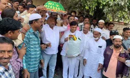 Minister Gangula Kamalakar and state Planning Commission vice president  B Vinod Kumar flag off haj yatra bus of Muslims in Karimnagar on Monday