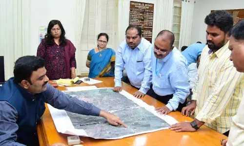 Krishna District Collector Ranjit Basha discussing with the officials the construction of Vijayawada East bypass connecting Krishna and Guntur districts in Machilipatnam on Monday