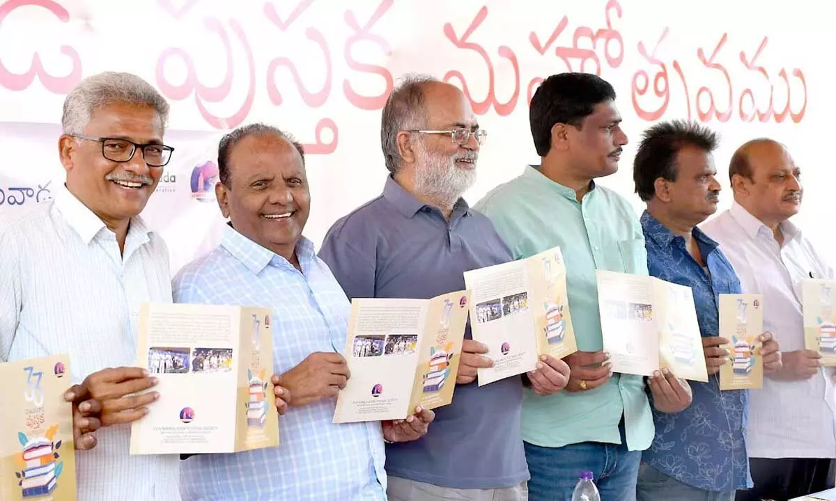 Book Festival Society members releasing brochures on the  festival at Polytechnic College grounds in Vijayawada on Tuesday Photo: Ch Venkata Mastan